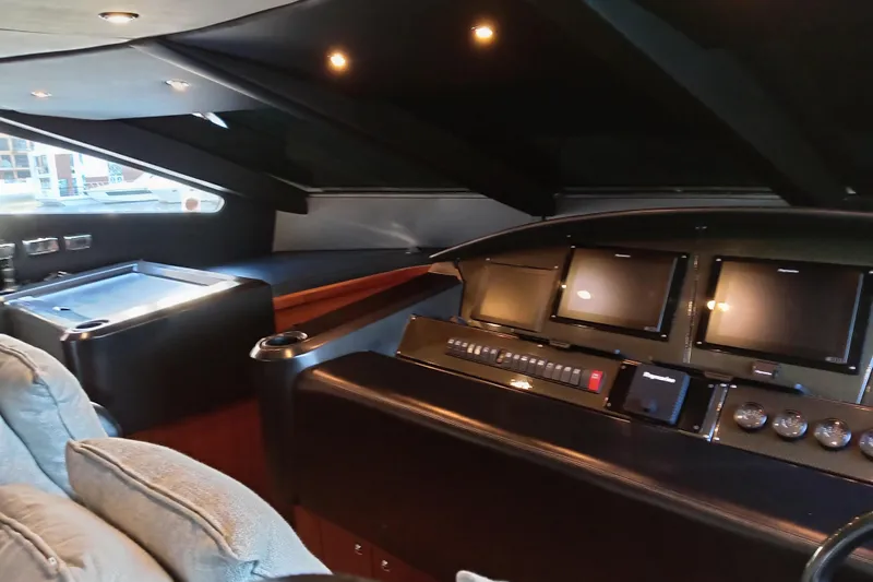  Yacht Photos Pics Interior cockpit of 2006 Sunseeker Predator 82 yacht with modern navigation displays.