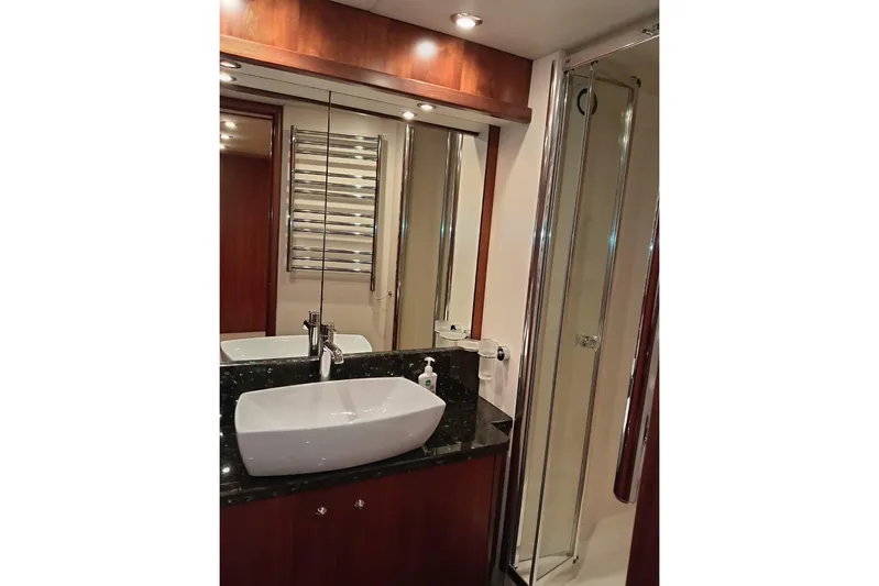  Yacht Photos Pics Luxurious bathroom in 2006 Sunseeker Predator 82 yacht with modern sink and shower.