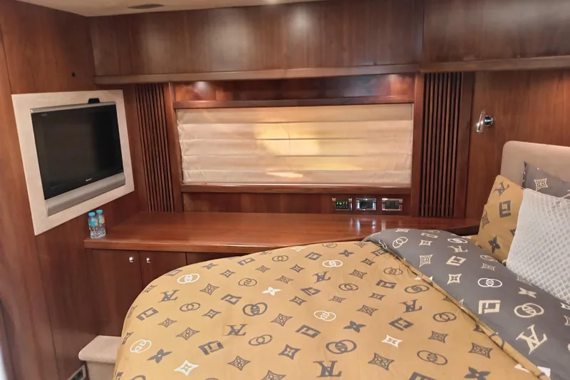  Yacht Photos Pics Luxurious cabin interior of 2006 Sunseeker Predator 82 yacht with elegant wood finish.