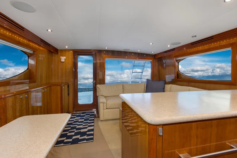 Lady A Yacht Photos Pics Luxurious interior of 2008 Hatteras 54 Convertible yacht with panoramic ocean views.
