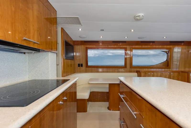 Lady A Yacht Photos Pics Luxurious interior of 2008 Hatteras 54 Convertible yacht with modern kitchen and ocean view.