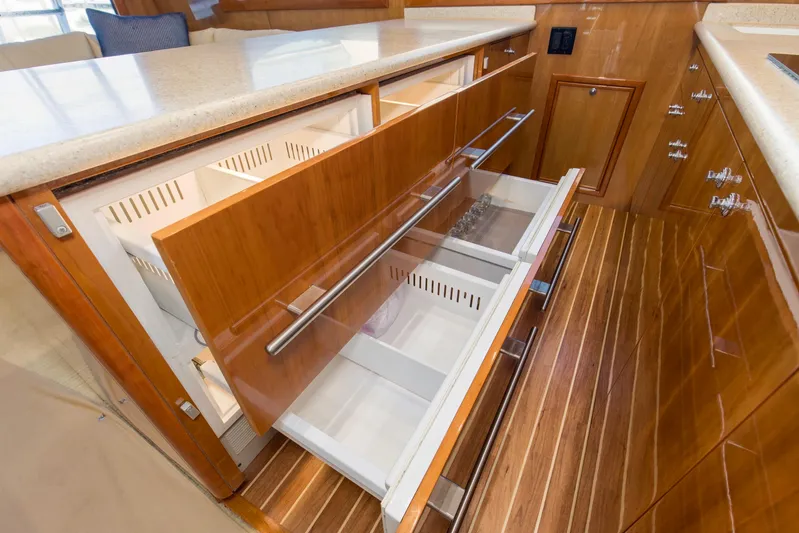 Lady A Yacht Photos Pics Luxury kitchen drawers in 2008 Hatteras 54 Convertible yacht, featuring sleek wood finish.