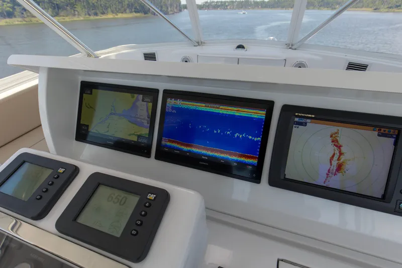 Lady A Yacht Photos Pics Helm of 2008 Hatteras 54 Convertible with navigation displays and controls.
