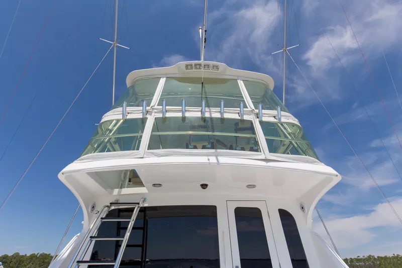 Lady A Yacht Photos Pics 2008 Hatteras 54 Convertible yacht, featuring sleek design and glass-enclosed upper deck.