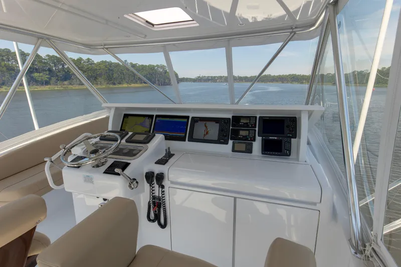 Lady A Yacht Photos Pics Helm of 2008 Hatteras 54 Convertible yacht with navigation equipment and scenic water view.