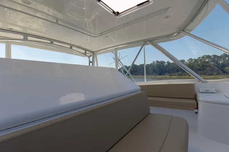 Lady A Yacht Photos Pics Interior view of 2008 Hatteras 54 Convertible yacht with seating and windows.