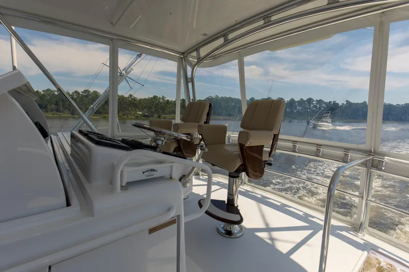 Lady A Yacht Photos Pics 2008 Hatteras 54 Convertible yacht interior with helm chairs and scenic water view.
