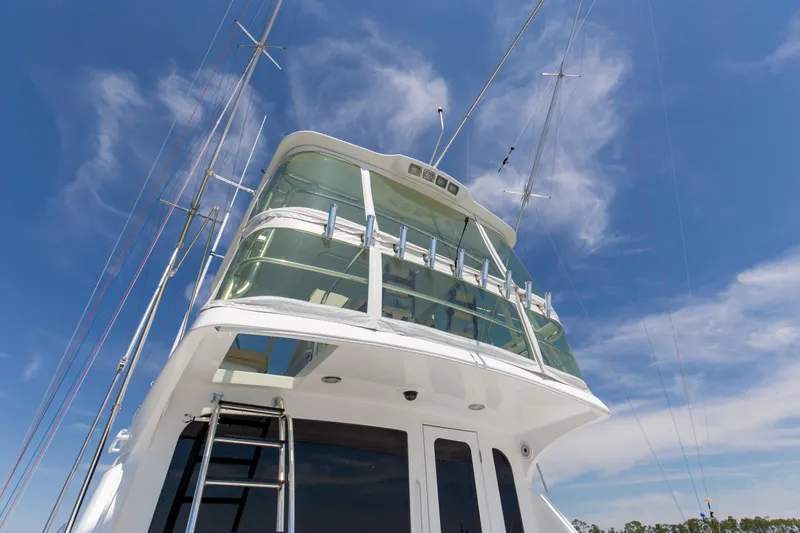 Lady A Yacht Photos Pics 2008 Hatteras 54 Convertible yacht against a clear blue sky.