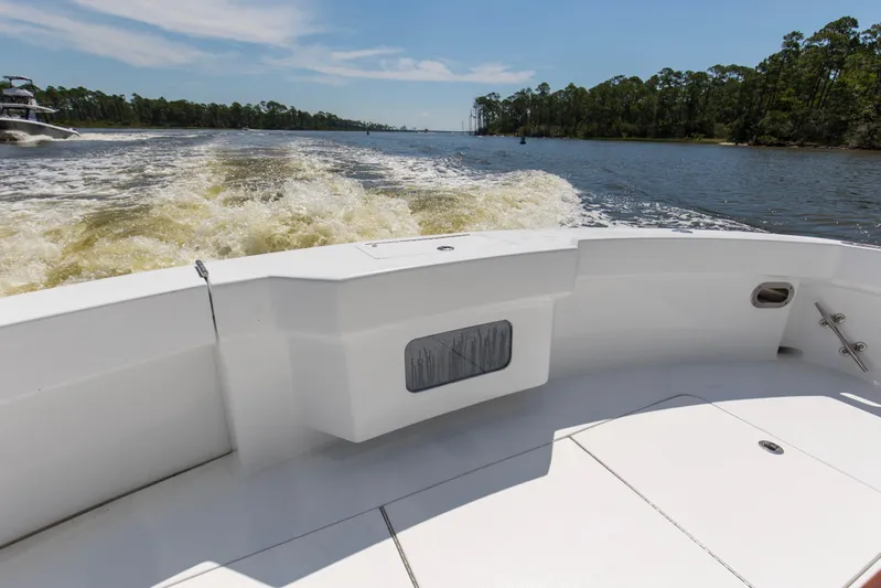 Lady A Yacht Photos Pics 2008 Hatteras 54 Convertible boat cruising on a scenic river with forested banks.