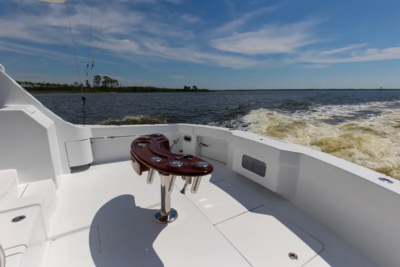Lady A Yacht Photos Pics 2008 Hatteras 54 Convertible yacht deck with ocean view and fishing rod holders.