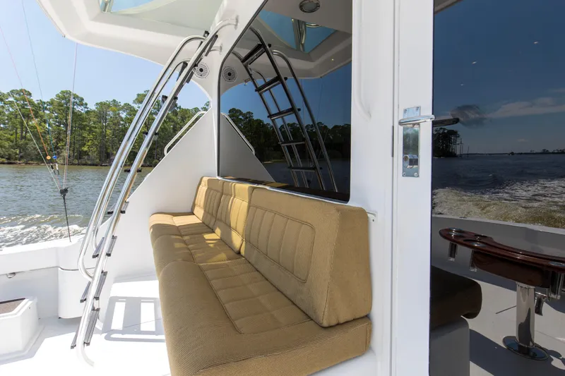 Lady A Yacht Photos Pics 2008 Hatteras 54 Convertible yacht interior with beige seating and scenic water view.