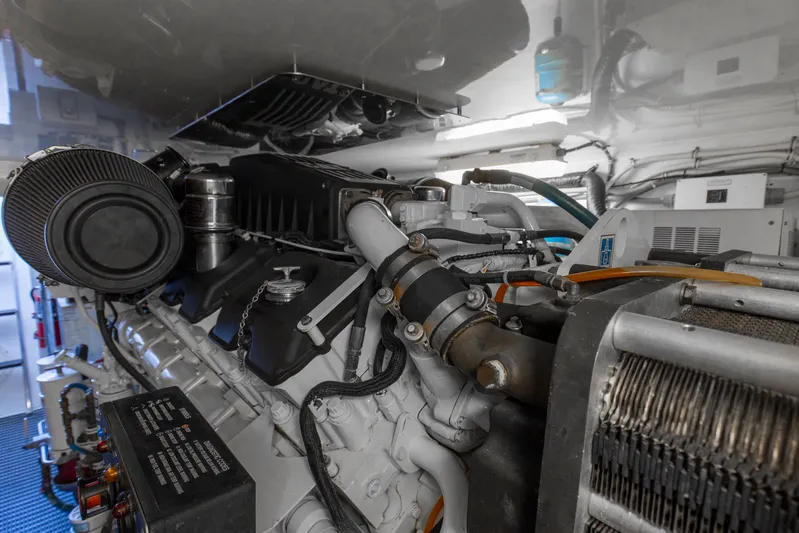 Lady A Yacht Photos Pics Engine room of 2008 Hatteras 54 Convertible yacht, showcasing detailed machinery and components.