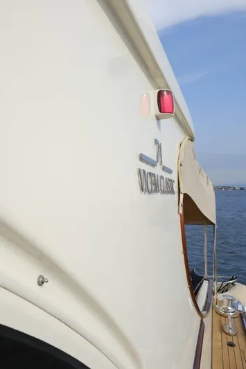  Yacht Photos Pics 2009 Vicem Classic 71 yacht side view with logo, docked by the water.