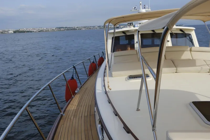  Yacht Photos Pics 2009 Vicem Classic 71 yacht cruising on open water with spacious deck.