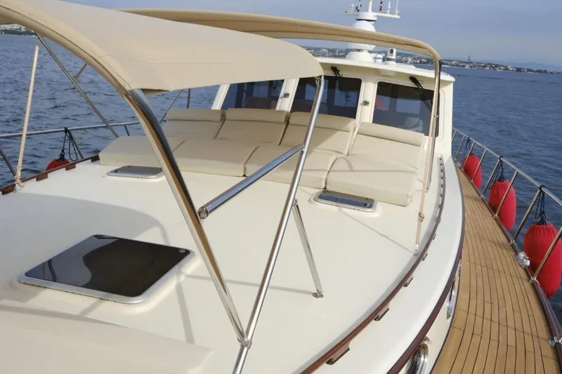  Yacht Photos Pics 2009 Vicem Classic 71 yacht with sun deck and canopy on calm water.