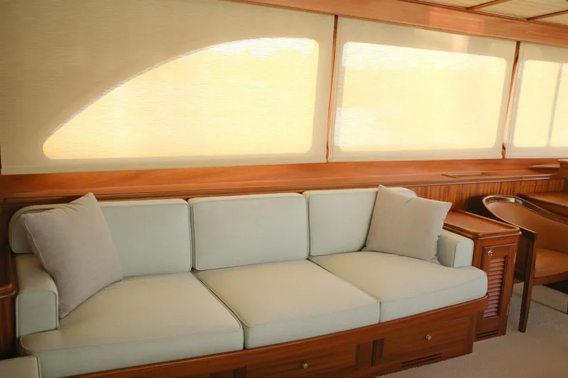  Yacht Photos Pics Luxurious interior of 2009 Vicem Classic 71 yacht with elegant sofa and wooden accents.