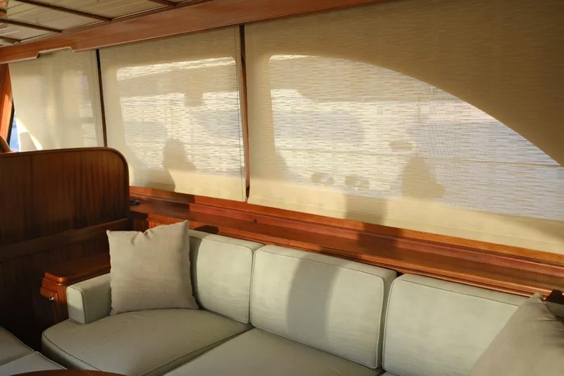  Yacht Photos Pics Luxurious interior of 2009 Vicem Classic 71 yacht with elegant wood and soft seating.