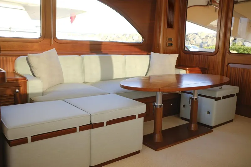  Yacht Photos Pics Luxurious interior of 2009 Vicem Classic 71 yacht with elegant seating and wooden table.