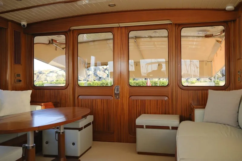  Yacht Photos Pics Luxurious interior of 2009 Vicem Classic 71 yacht with elegant wood finish and comfortable seating.