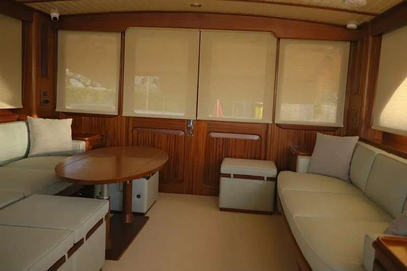  Yacht Photos Pics Interior of 2009 Vicem Classic 71 yacht with elegant wood paneling and comfortable seating.