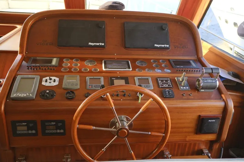 Yacht Photos Pics Helm of 2009 Vicem Classic 71 yacht with wooden steering wheel and navigation instruments.