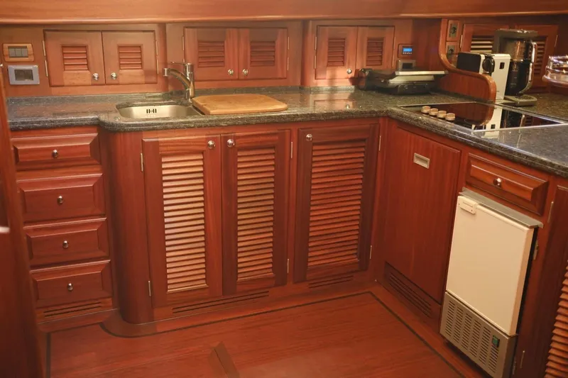  Yacht Photos Pics Luxurious wooden kitchen interior of 2009 Vicem Classic 71 yacht with modern amenities.