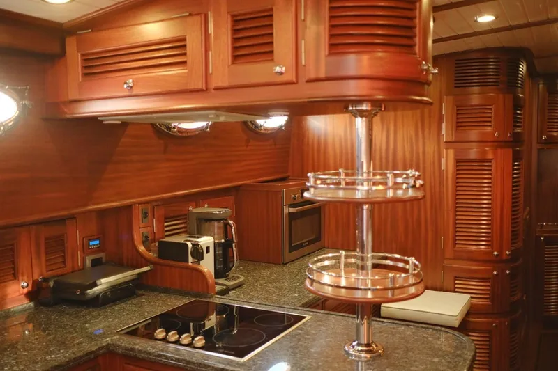  Yacht Photos Pics Luxurious wooden kitchen interior of 2009 Vicem Classic 71 yacht with modern appliances.