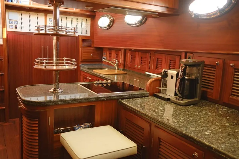  Yacht Photos Pics Luxurious 2009 Vicem Classic 71 yacht kitchen with wood cabinetry and granite countertops.