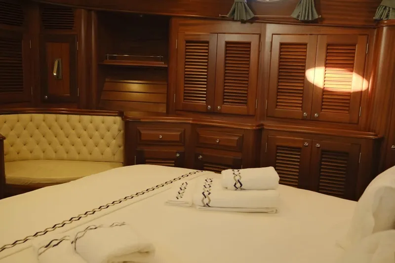  Yacht Photos Pics Luxurious wood-paneled cabin interior of 2009 Vicem Classic 71 yacht with plush seating.