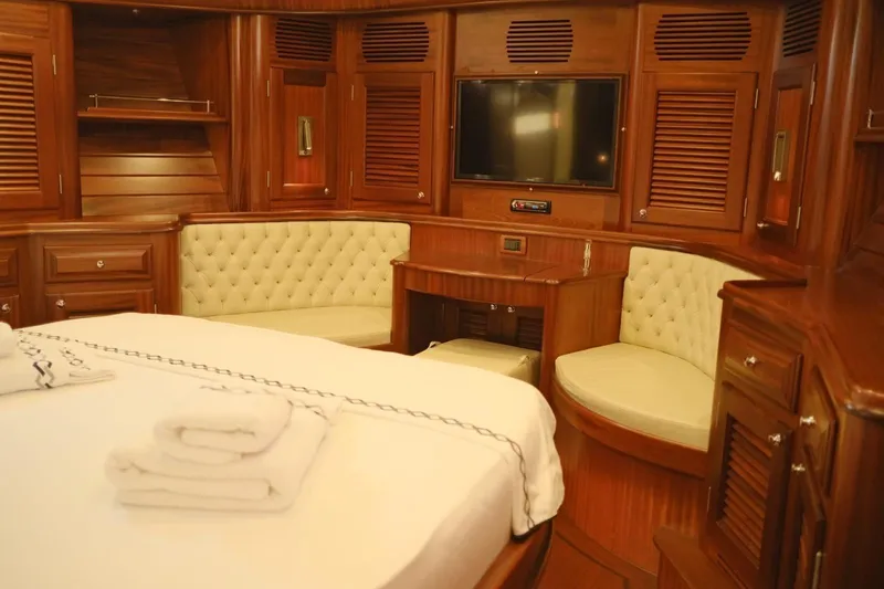  Yacht Photos Pics Luxurious 2009 Vicem Classic 71 yacht cabin with wood paneling and plush seating.