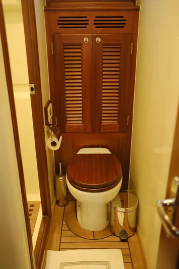  Yacht Photos Pics 2009 Vicem Classic 71 yacht bathroom with wooden cabinetry and modern fixtures.