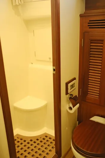  Yacht Photos Pics Bathroom interior of 2009 Vicem Classic 71 yacht with wooden accents.