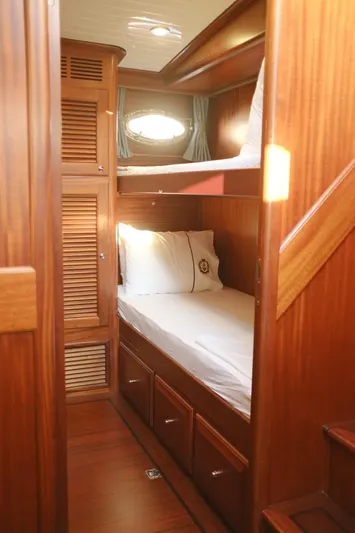  Yacht Photos Pics 2009 Vicem Classic 71 yacht cabin with wooden interior and bunk beds.