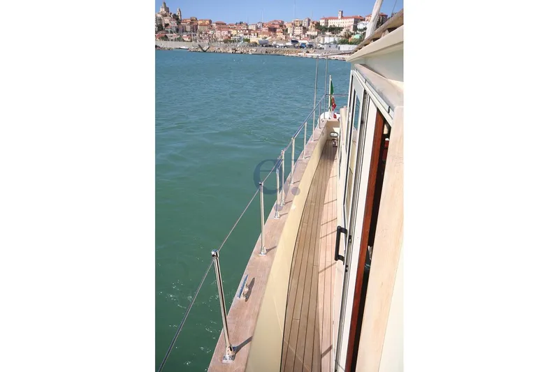  Yacht Photos Pics Deck view of 2012 Sibma Navale Italiana Armstrong 12 yacht near coastal town.