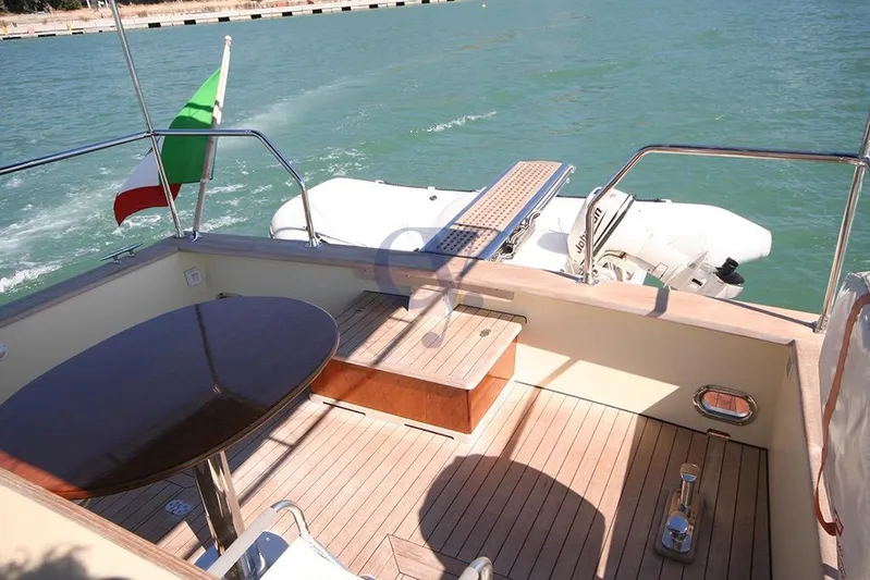  Yacht Photos Pics Deck of 2012 Sibma Navale Italiana Armstrong 12 yacht with Italian flag and tender boat.