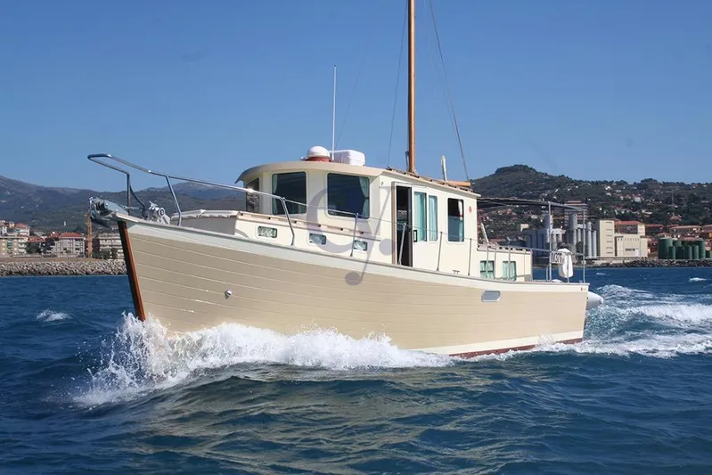  Yacht Photos Pics Sibma Navale Italiana Armstrong 12 boat cruising on blue waters, 2012 model.
