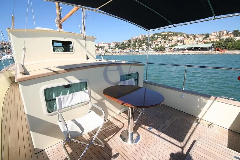  Yacht Photos Pics Deck view of 2012 Sibma Navale Italiana Armstrong 12 yacht, featuring seating and table.