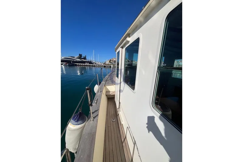  Yacht Photos Pics Side view of 2012 Sibma Navale Italiana Armstrong 12 yacht docked in marina.