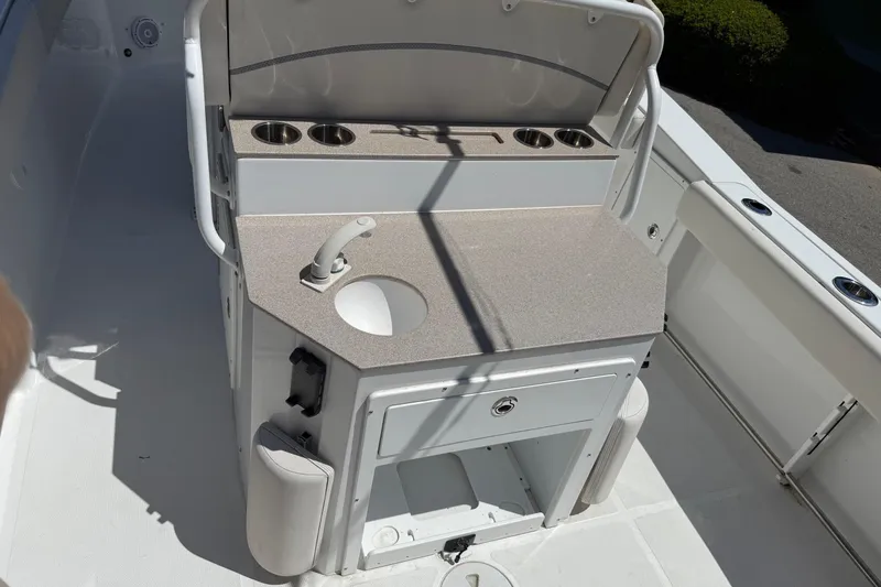  Yacht Photos Pics Interior view of 2023 Sea Hunt Ultra 275 SE with sink and storage.
