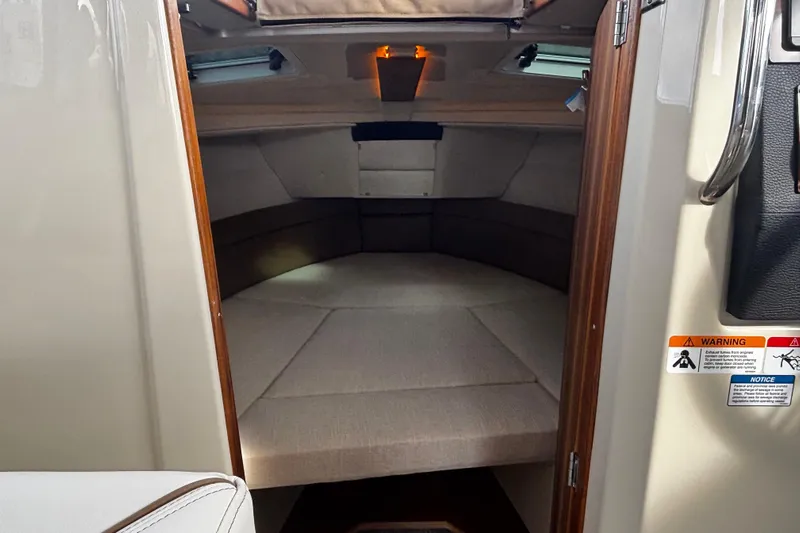  Yacht Photos Pics 2026 Ranger Tugs R-23 cabin interior with cozy sleeping area and modern design.