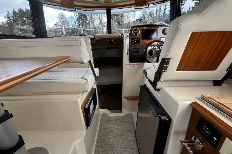 Yacht Photos Pics Interior of 2026 Ranger Tugs R-23 boat with modern seating and navigation controls.