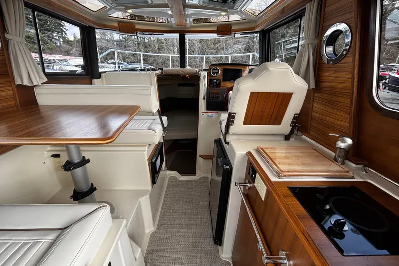  Yacht Photos Pics Interior of 2026 Ranger Tugs R-23 boat with wood accents and modern amenities.