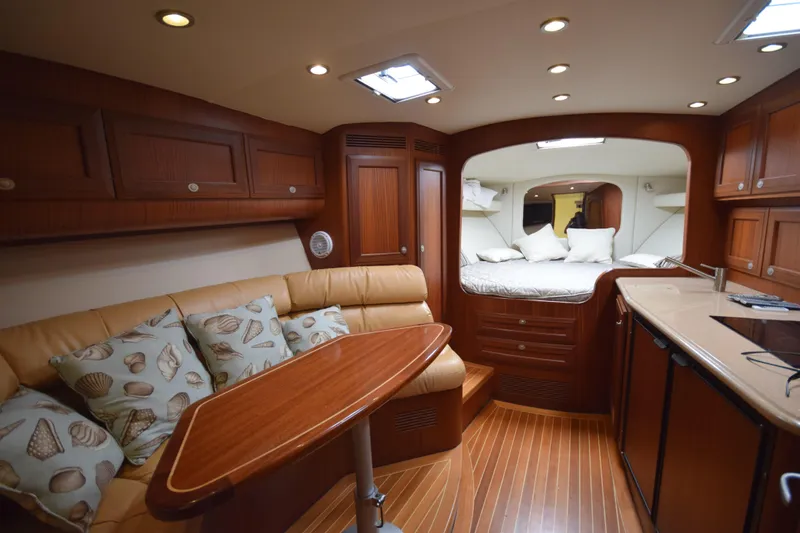  Yacht Photos Pics Luxurious 2009 Jupiter 39 Express yacht interior with elegant wood finish and cozy seating area.