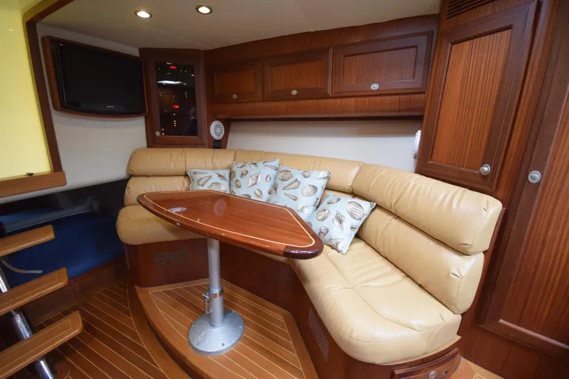  Yacht Photos Pics Luxurious interior of 2009 Jupiter 39 Express yacht with leather seating and wooden finishes.