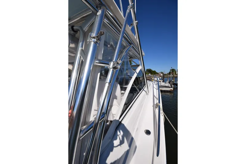  Yacht Photos Pics 2009 Jupiter 39 Express boat with sleek chrome details and clear blue sky.