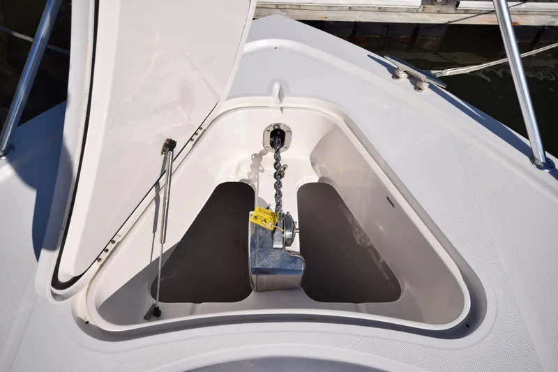  Yacht Photos Pics Anchor compartment of 2009 Jupiter 39 Express boat, open hatch, chain visible.