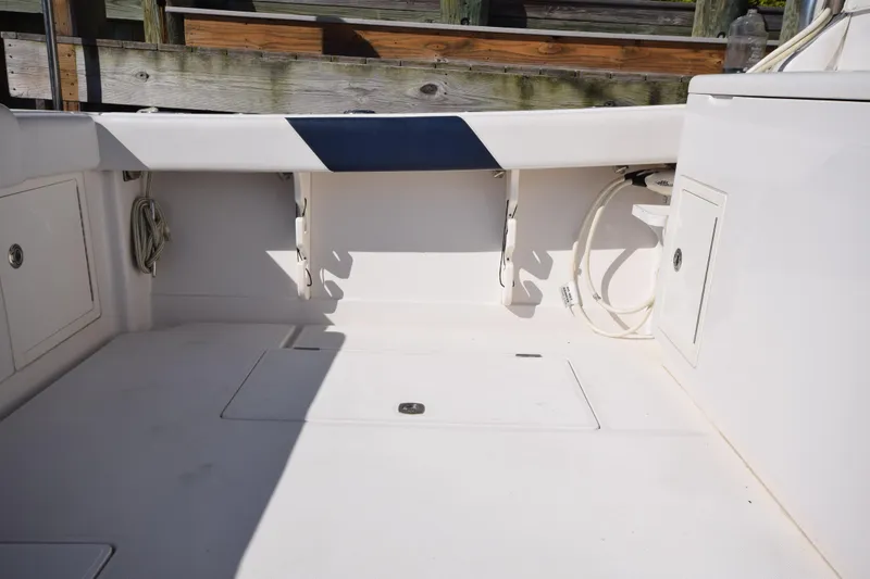  Yacht Photos Pics 2009 Jupiter 39 Express boat deck with storage compartments and clean white finish.