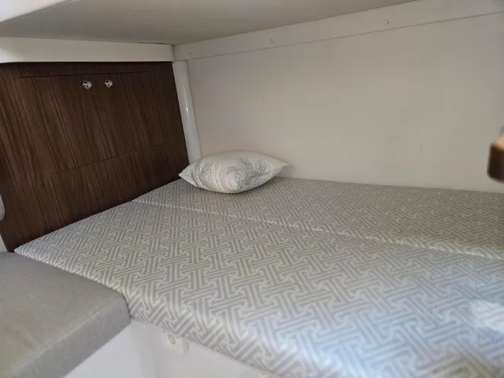 Love You More Yacht Photos Pics 2019 Four Winns H350 cabin interior with a cozy bed and pillow.