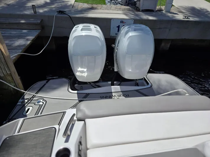 Love You More Yacht Photos Pics 2019 Four Winns H350 boat with dual outboard engines docked.