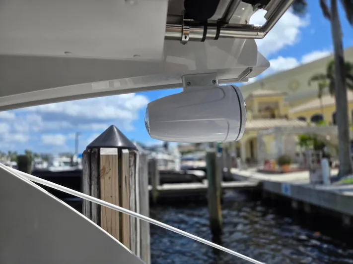 Love You More Yacht Photos Pics 2019 Four Winns H350 boat with a mounted speaker at a marina.